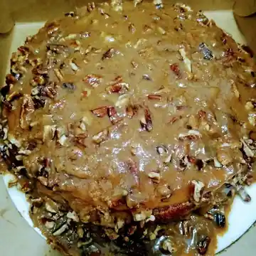 Pecan cheesecake covered in praline pecan topping